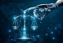 Robot hand touches justice scales