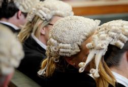 Anonymous female barristers wearing wigs