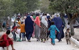 Internally displaced families from northern provinces, who fled from their homes due to the fighting between Taliban and Afghan security forces, take shelter in a public park in Kabul, Afghanistan