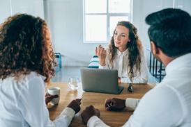 Solicitor talks with her clients
