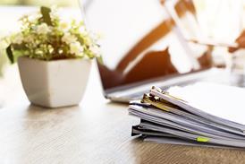 Pile of documents on desk