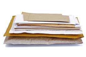 A pile of post in brown and white envelopes