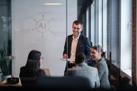 An office team meeting discussing artificial intelligence