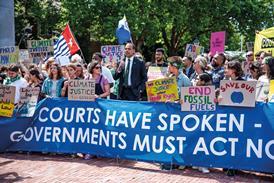 Protesters outside the International Court of Justice after it issued its advisory on climate change in 2025