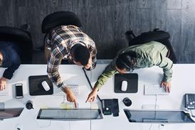 Two colleagues work together in the office