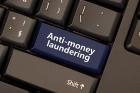 Anti-money laundering button on computer keyboard