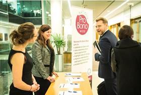 Banner photo of member at the National Pro Bono Week events