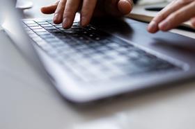 Person typing on laptop