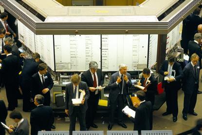 Brokers on the old trading floor of the London Stock Exchange, a few days before its replacement by the Stock Exchange Automated Quotation system, October 1986