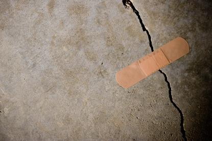 A plaster stuck over a crack in concrete