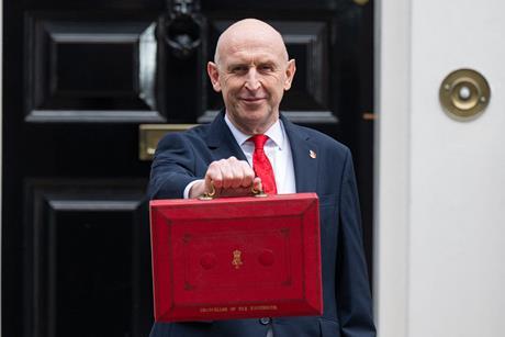 Chancellor John Healey leaves Number 11 Downing Street to present his Autumn Budget in the House of Commons