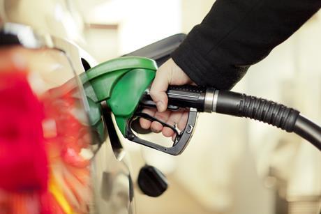 Pumping petrol into a car