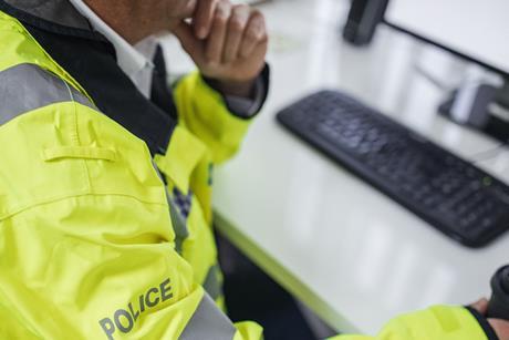 Police officer at desk