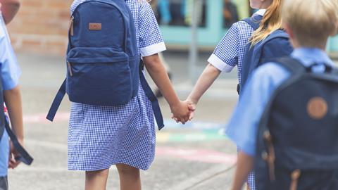 Primary school children walking to school