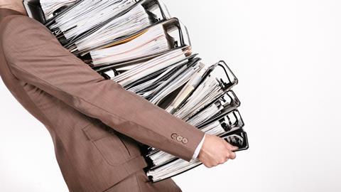 Businesswoman carrying files