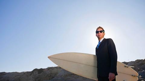 Businessman surfer