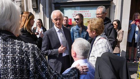 Sir Brian Langstaff with victims and campaigners of the infected blood inquiry