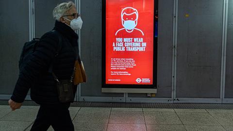 A sign at Westminster underground station warning passengers to wear a face covering