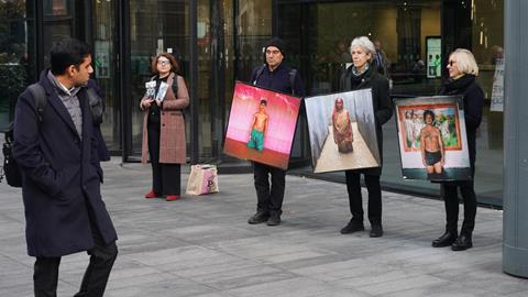 Lawyers and campaigners staged a climate protest outside the London offices of A&O Shearman and Akin