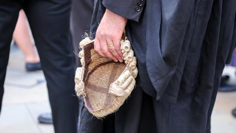 Barrister holds wig