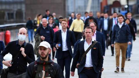 Office workers walking across London Bridge during Covid
