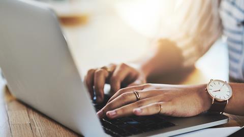 Woman typing on laptop