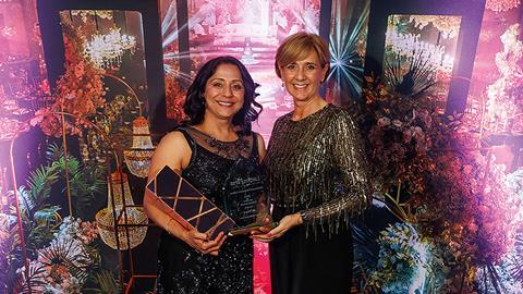 Jas Thiara receives the excellence in professional services award from Tracy Evans of Alsters Kelley