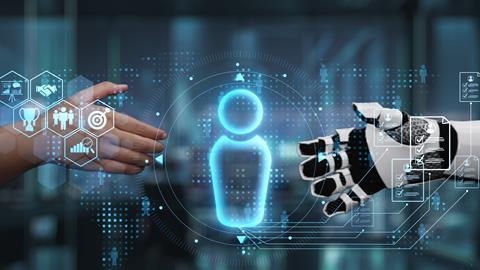 Human hand reaches out to shake robot hand