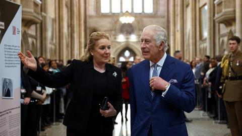 King Charles III walks with Lady Chief Justice Sue Carr as he visits the Royal Courts of Justice, 14 December 2023