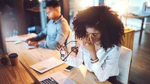 Woman stressed at office desk