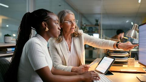 Office trainee works alongside her mentor