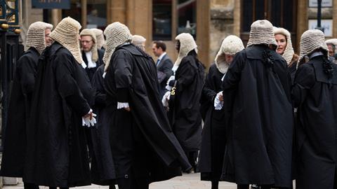 Judges wearing robes and wigs