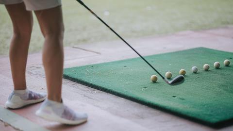 Anonymous golfer at driving range