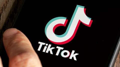 TikTok logo dispayed on a phone