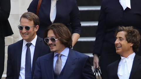 Johnny Depp leaving court with his barristers following libel case