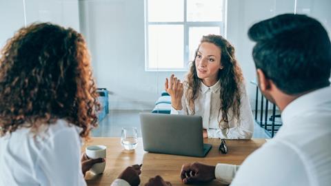 Solicitor talks with her clients