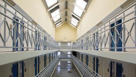 The corridors of a prison showing cell doors