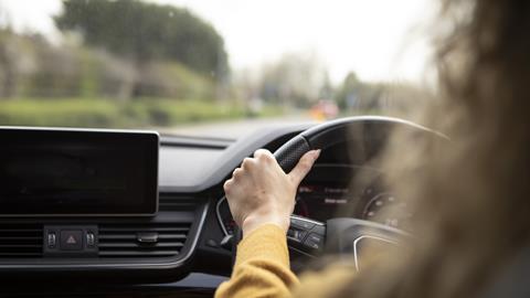 Anonymous woman drives car