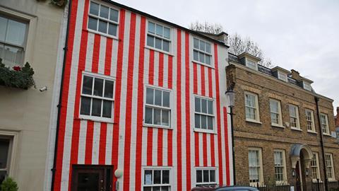 Multi-million-pound townhouse in Kensington painted with red and white vertical stripes