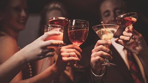 A group of collegues raise their glasses