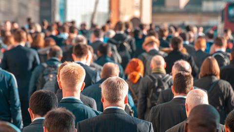 A crowd of office workers walking to work