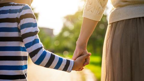 Parent and child holding hands
