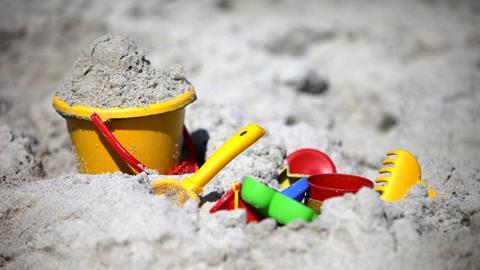 Bucket and spades in sand