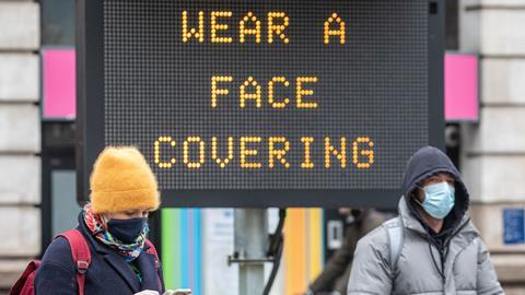 Commuters in masks arrive in Westminster during Covid pandemic