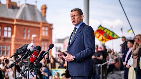 First minister of Wales Rhun ap Iorwerth talks to media on the steps of the Senedd
