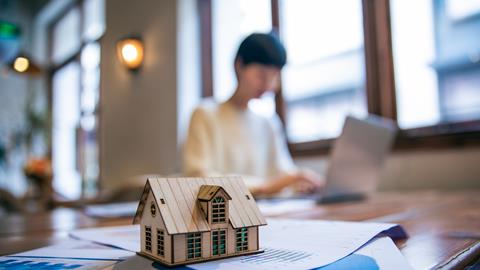 Housing solicitor works on a laptop