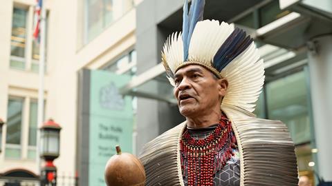 Indigenous Brazilians outside Rolls Building