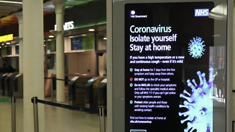 A coronavirus information sign at King's Cross railway station