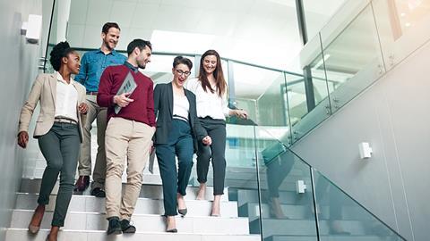 Office workers walk together