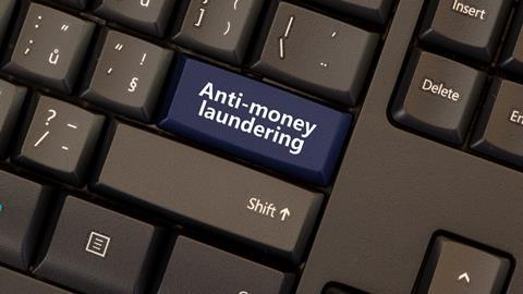 Anti-money laundering button on computer keyboard
